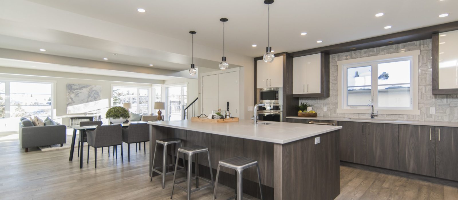 A beautiful shot of a modern house kitchen and dining room