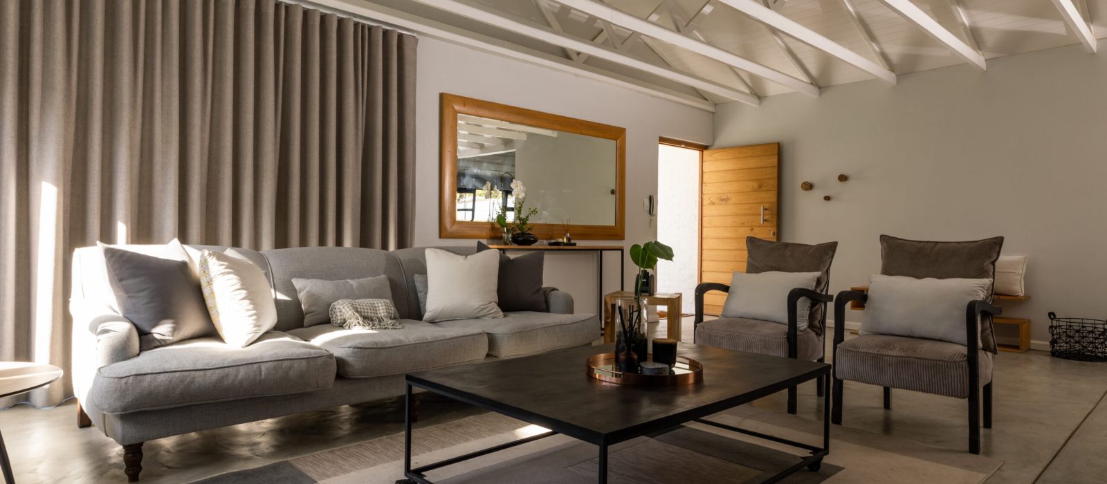 Sofa and armchairs by center table in living room at home. unaltered, furniture, home and interior decoration concept.